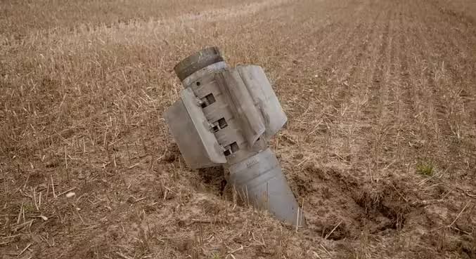 Landmine warning marker in an agricultural field